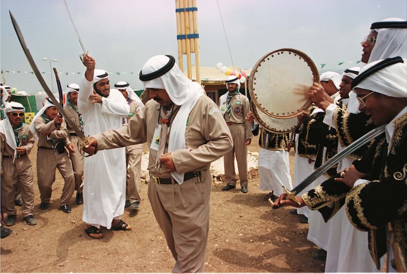 A Saudi Arabian scout group performs the sword dance in Byblos, Lebanon, marking the end of the 23rd annual meeting of Arab scouts in 1998. Reuters