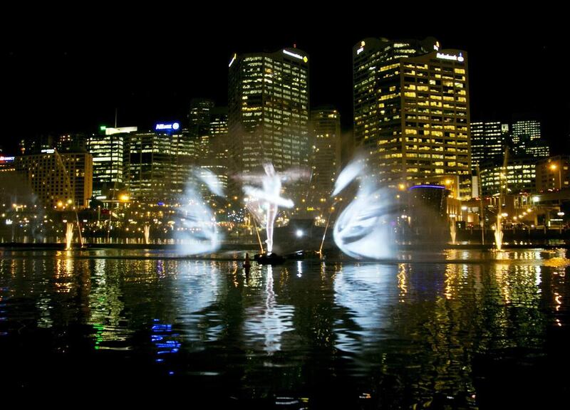 A light show featuring a ballet dancer and swans from Swan Lake is projected onto spraying water by the Vivid Aquatique Water Theatre during a preview of the Vivid Sydney light and music festival May 21, 2014. For 18 days beginning on May 23 the Vivid Sydney festival, one of the world’s largest creative industry forums, will combine outdoor lighting sculptures and installations. Jason Reed / Reuters