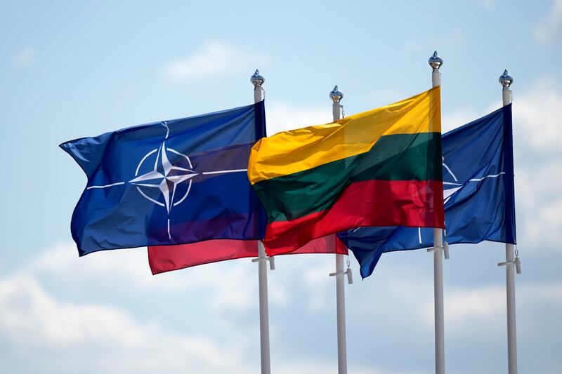 A Nato and Lithuanian flag at the venue on the second day of the summit. AP