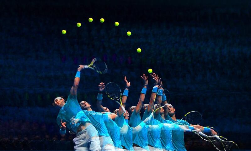 In this composite photo, Rafael Nadal of Spain serves iagainst Stanislas Wawrinka of Switzerland during their ATP World Tour Finals match on Wednesday. Nadal won in straight sets. Michael Regan / Getty Images