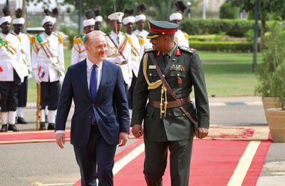 US ambassador to Sudan John Godfrey walks alongside a presidential guard of honour in Khartoum during a ceremony marking the presentation of his credentials. AFP