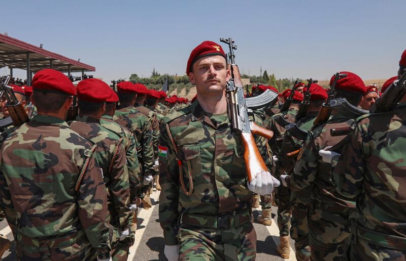 Iraqi-Kurdish Peshmerga officers take part in a graduation ceremony in Erbil. Media outlets have speculated that the force may be 200,000-strong, but this figure is highly disputed. AFP