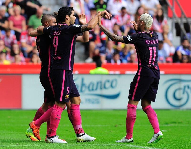 Barcelona midfielder Rafael Alcantara celebrates his goal with Luis Suarez and Neymar. Ander Gillenea / AFP