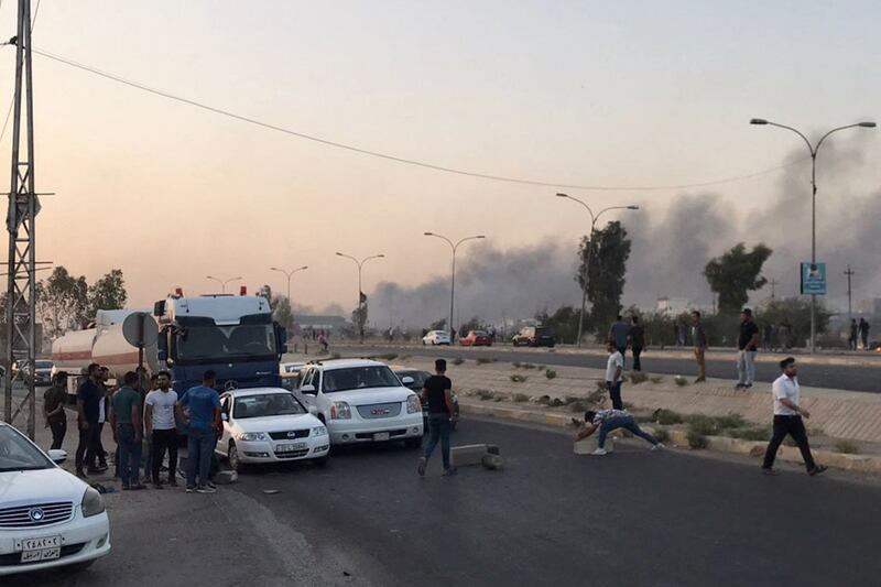 Iraqi protesters block a road following protests in the multi-ethnic Iraqi city of Kirkuk.