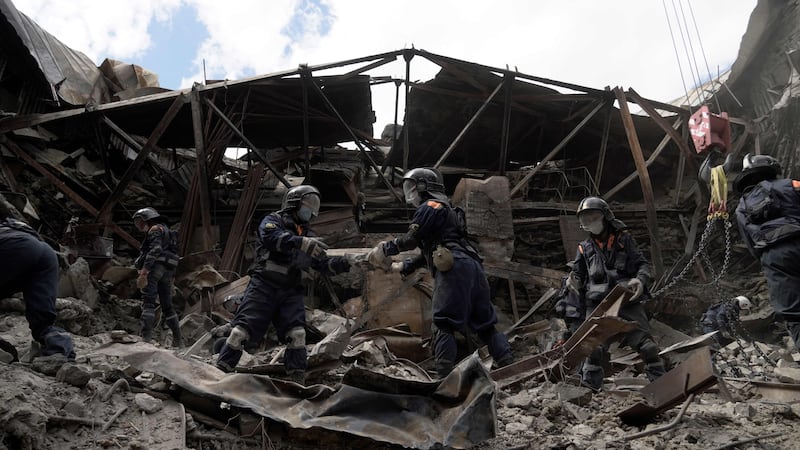 Russian emergency personnel clear debris inside Mariupol's drama theatre. AFP