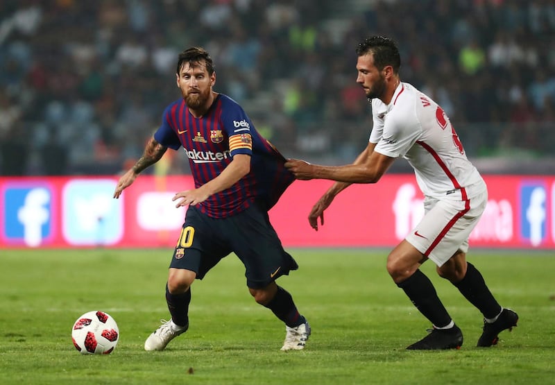 Barcelona's Lionel Messi in action with Sevilla's Franco Vazquez. Reuters