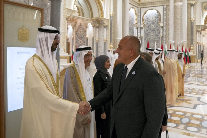 ABU DHABI, UNITED ARAB EMIRATES - October 21, 2018: HE Omar bin Sultan Al Olama, UAE Minister of State for Artificial Intelligence (L), greets HE Boyko Borissov, Prime Minister of Bulgaria (R), during a reception at the Presidential Palace. Seen with HE Zaki Anwar Nusseibeh, UAE Minister of State (2nd L).

( Hamad Al Kaabi / Crown Prince Court - Abu Dhabi )
---