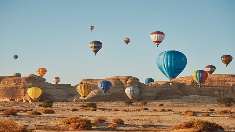 Take to the skies of AlUla, Saudi Arabia, in hot-air balloons for unparalleled views of the desert. Photo: RCU