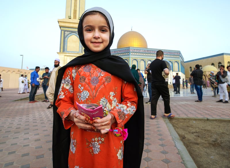Malek Mohamed, 7, after Eid prayers with her candies and Eid gift.
Victor Besa / The National