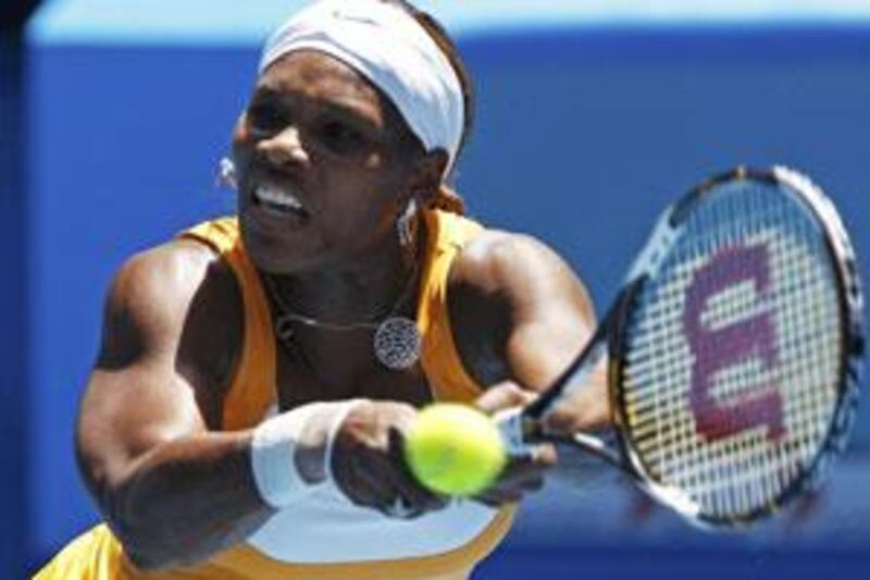 Serena Williams hits a return against Poland's Urszula Radwanska during the Australian Open tennis tournament in Melbourne.