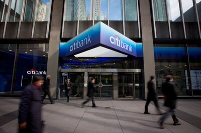 Pedestrians walking past a Citibank branch adjacent to Citigroup's headquarters in New York. Bloomberg via Getty Images