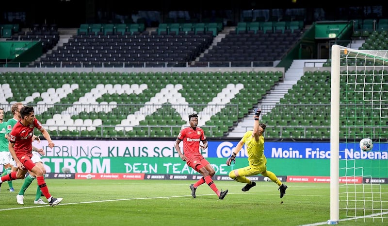 Kai Havertz, left, scores to give Leverkusen a 2-1 lead over Bremen. EPA