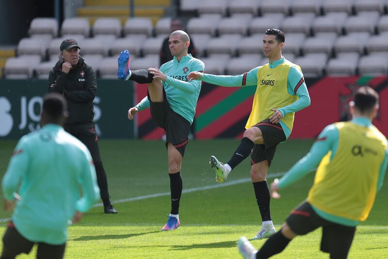 Pepe and Cristiano Ronaldo warm up during a training session at Estadio do Bessa in Porto, Portugal on March 27 2022, ahead of Portugal's Fifa World Cup Qatar 2022 play-off against North Macedonia. EPA