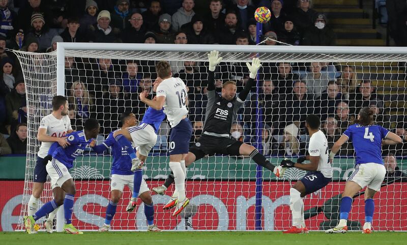 Harry Kane beats Leicester goalkeeper Kasper Schmeichel but the ball hits the crossbar. AFP