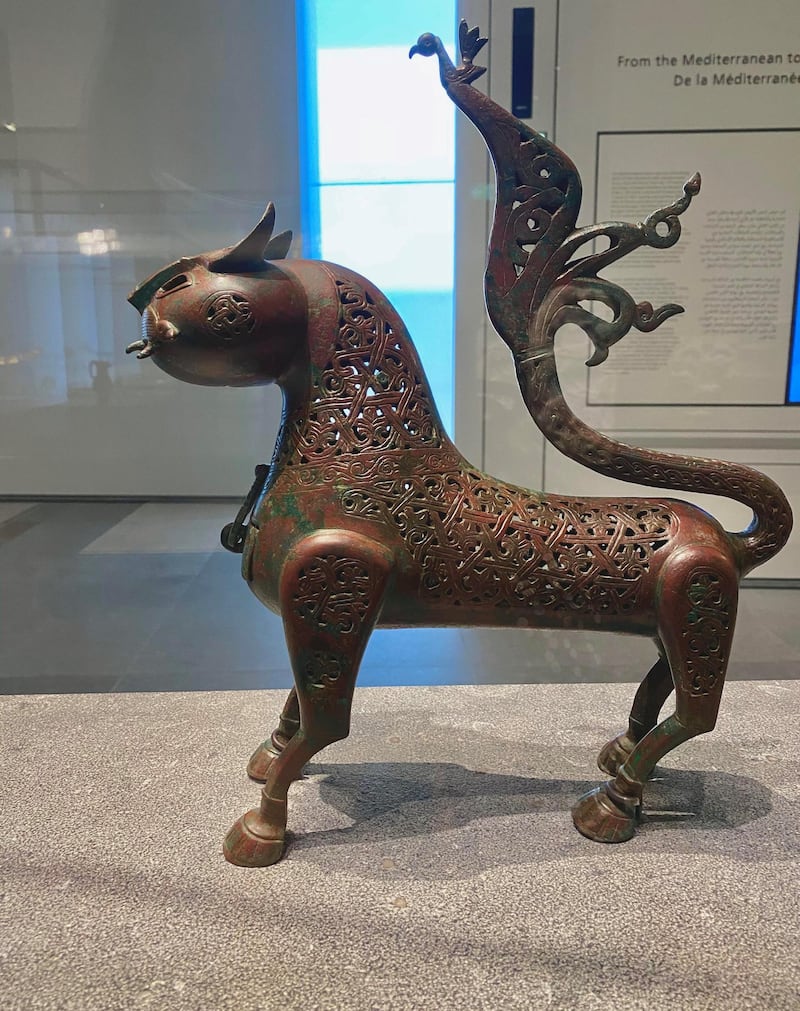 This bronze feline-shaped incense burner from the 11th century is from eastern Iran or Central Asia. During its use, its eyes were likely encrusted with blue paste or turquoise. Its design is notable for its decorative tail, which splits into various birds. Courtesy DCT Abu Dhabi