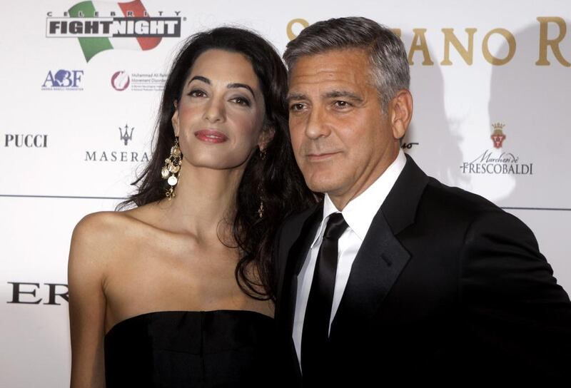 George and Amal Clooney welcomed twins Alexander and Ella in June. Francesco Bellini / AP Photo