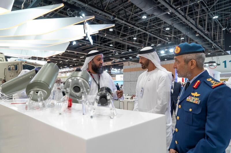 ABU DHABI, UNITED ARAB EMIRATES - February 17, 2019:  HH Sheikh Mohamed bin Zayed Al Nahyan, Crown Prince of Abu Dhabi and Deputy Supreme Commander of the UAE Armed Forces (C) visits the Halcon systems stand, during the 2019 International Defence Exhibition and Conference (IDEX), at Abu Dhabi National Exhibition Centre (ADNEC). Seen with HE Major General Essa Saif Al Mazrouei, Deputy Chief of Staff of the UAE Armed Forces (R).

( Rashed Al Mansoori / Ministry of Presidential Affairs )
---