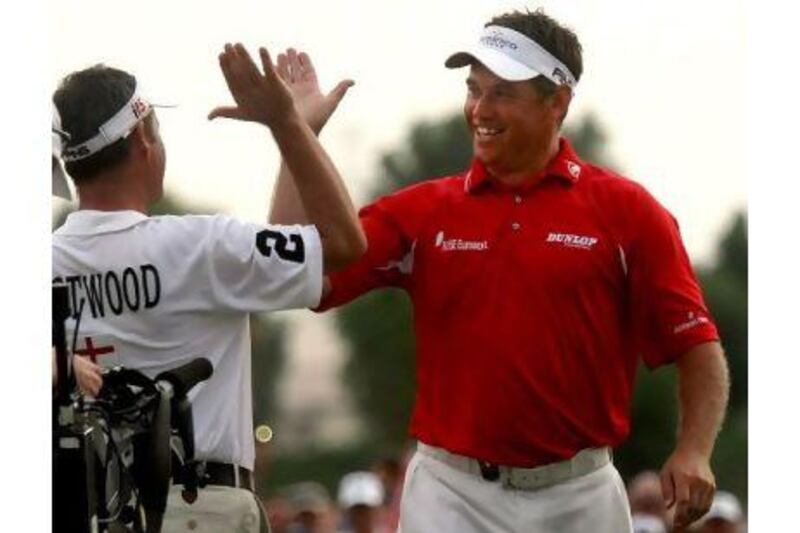 Lee Westwood, right, celebrates with Billy Foster, his caddie, after winning the Dubai World Championship in 2009.