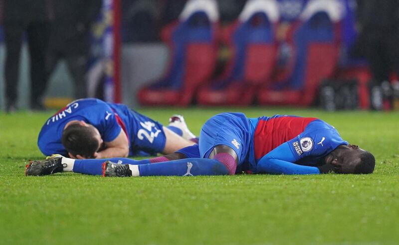 Crystal Palace's Gary Cahill and Cheikhou Kouyate on the ground after sustaining an injury during the match against West Ham. Reuters