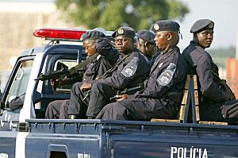 Armed Angolan police escort the bus carrying the Ghana players as it leaves the compound in Cabinda where team, who are in the same group as Togo were, are based.