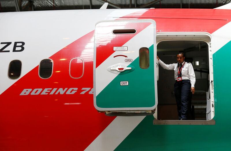 A Kenya Airways staff member is seen at the rear door of a Boeing Dreamliner 787-8 inside a hangar at their headquarters in Nairobi, Kenya June 27, 2018. REUTERS/Thomas Mukoya