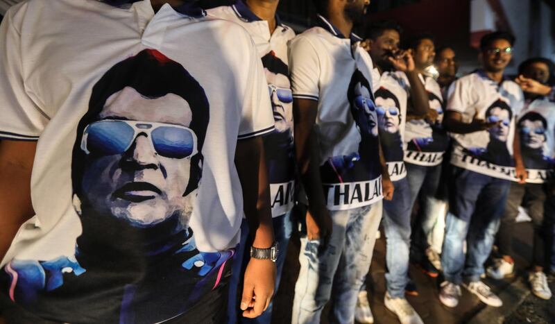 Fans of Rajinikanth wear t-shirts with his portrait as they celebrate the release of his long-awaited film "2.0" in Mumbai, India. EPA
