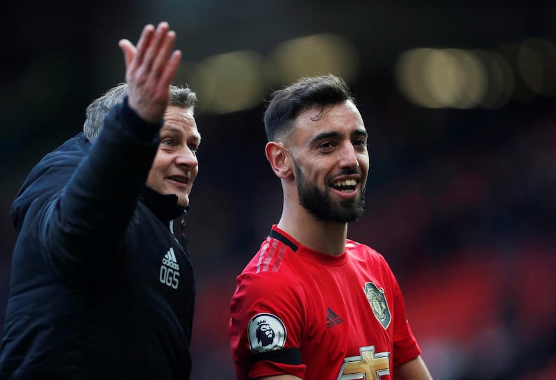 Soccer Football - Premier League - Manchester United v Watford - Old Trafford, Manchester, Britain - February 23, 2020  Manchester United manager Ole Gunnar Solskjaer celebrates with Bruno Fernandes after the match   Action Images via Reuters/Lee Smith  EDITORIAL USE ONLY. No use with unauthorized audio, video, data, fixture lists, club/league logos or "live" services. Online in-match use limited to 75 images, no video emulation. No use in betting, games or single club/league/player publications.  Please contact your account representative for further details.
