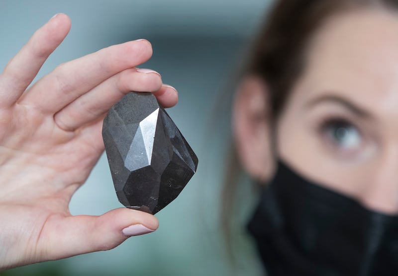 The Enigma, a 555.55-carat black diamond, the largest black natural colour diamond to appear at auctions at Sotheby's, Dubai. Ruel Pableo for The National