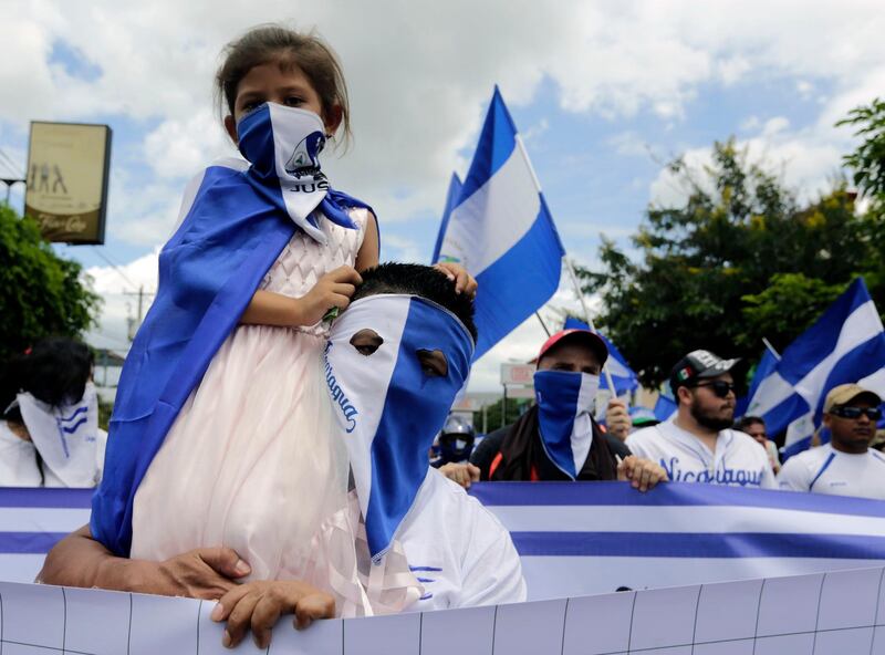 A girl is pictured during a march against Nicaraguan President Daniel Ortega's government in Managua, Nicaragua. Inti Ocon / AFP