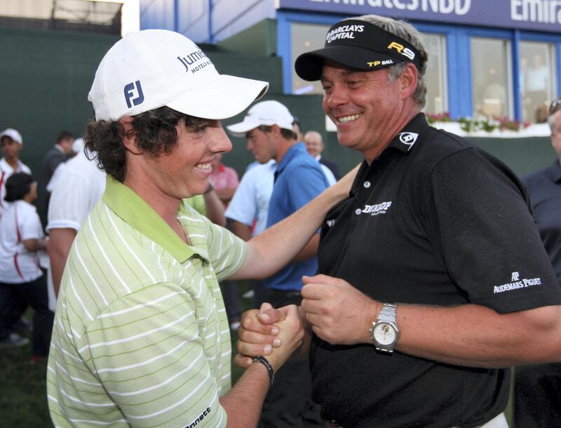 DUBAI, UNITED ARAB EMIRATES - FEBRUARY 01:  Rory McIlroy of Northern Ireland is congratulated by Darren Clarke of Northern Ireland after the of final round of the Dubai Desert Classic played on the Majlis Course on February 1, 2009 in Dubai,United Arab Emirates.  (Photo by Ross Kinnaird/Getty Images)