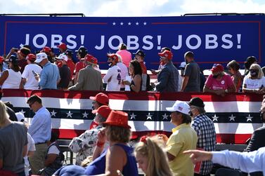 Supporters listen as US President Donald Trump delivers remarks on the economy in Wisconsin in August. The US added 661,000 jobs in September but the unemployment rate fell to 7.9 per cent, underscoring the economy's tortured recovery from Covid-19. AFP