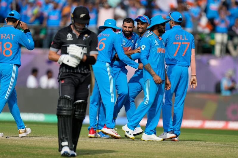 India players celebrate the wicket of New Zealand's Will Young. AP 