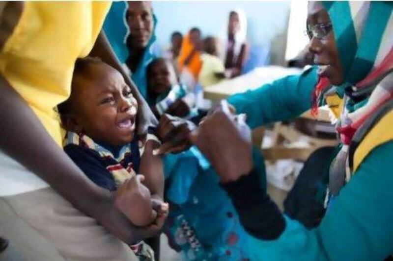 A Sudanese child receiving a vaccination against the meningitis at the community center in Al Neem camp for Internally Displaced People in el-Dain, East Darfur.