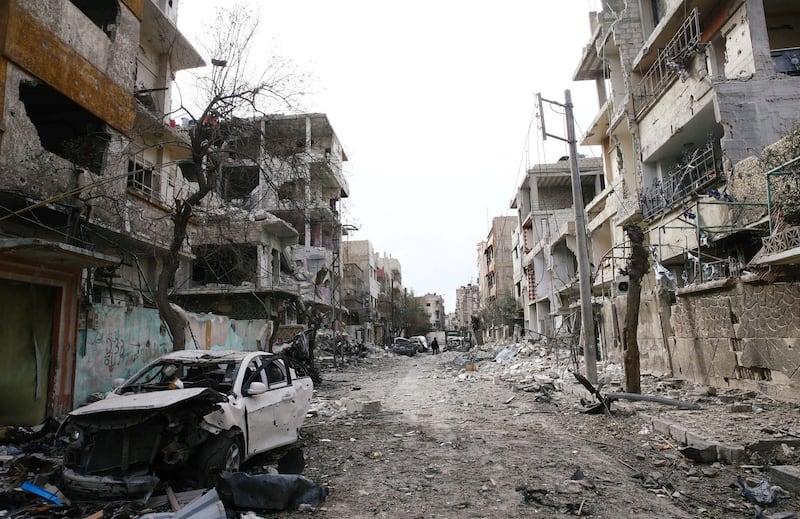 Damaged cars and buildings are seen in the besieged town of Douma, Eastern Ghouta, Damascus, Syria on February 25, 2018. Bassam Khabieh / Reuters