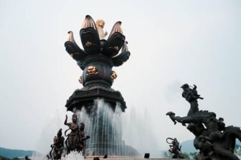 The "Nine Dragons Bath the Baby Buddha" exhibit, one of the unique attractions at the Wuxi Lingshan Buddhist Centre in northern China, is a consequence of the country's rising status as a tourist destination. (Photo by Effie-Michelle Metallidis)