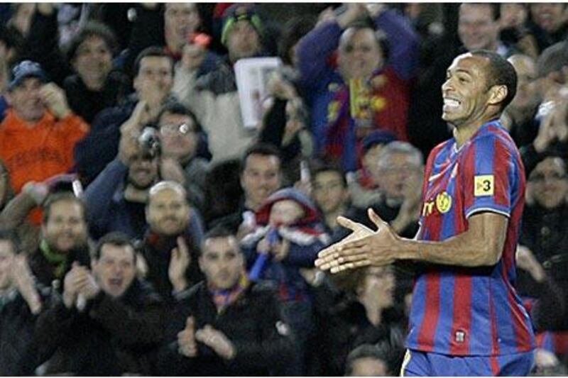Barcelona's French forward Thierry Henry celebrates his goal against Racing Santander.