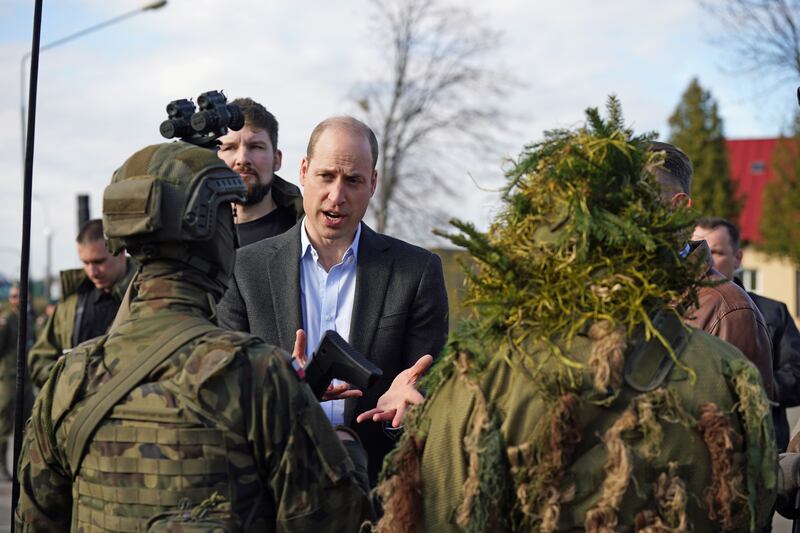 Prince William meets members of the Polish military during a visit to the 3rd Brigade Territorial Defence Force base. Getty 