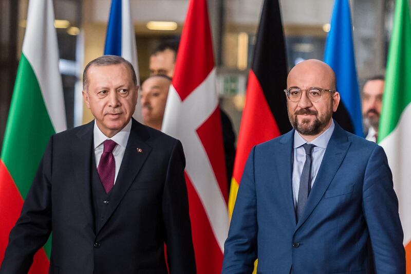 Recep Tayyip Erdogan, Turkey's president, left, and Charles Michel, president of the European Union (EU), arrive ahead of talks in Brussels, Belgium, on Monday, March 9, 2020. Ahead of high-level meetings in Brussels Monday, Erdogan urged Greece to open its borders to refugees, a call likely to further stir tensions with the EU as it grapples with the damage unleashed by the spread of the deadly and unpredictable coronavirus. Photographer: Geert Vanden Wijngaert/Bloomberg