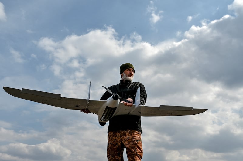 A Ukrainian soldier holds a drone near the front line in Zaporizhzhia region. Reuters