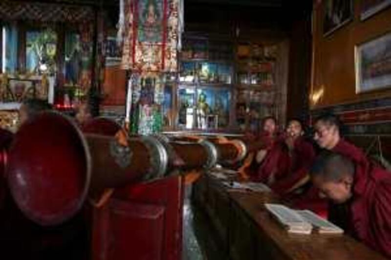 Exile Tibetan Buddhist monks blow ceremonial horns during a prayer session at Tsechokling Tibetan Monastery in Dharmsala, India, Saturday, March 14, 2009. (AP Photo/Altaf Qadri) *** Local Caption ***  AQX102_India_Tibet.jpg