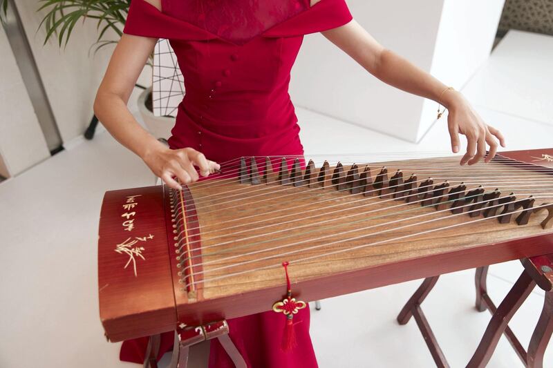 ABU DHABI, UNITED ARAB EMIRATES - JULY 18, 2018. 

A female plays the gzheng as part of UAE-China Week events at Manarat Al Saadiyat in Abu Dhabi, photos show UAE-China strong relationship over the past years.

 A pavilion to celebrate the UAE and Chinese culture was set up at the venue and will be the centerpiece of the UAE-China Week that runs until July 24.

(Photo by Reem Mohammed/The National)

Reporter: 
Section: NA