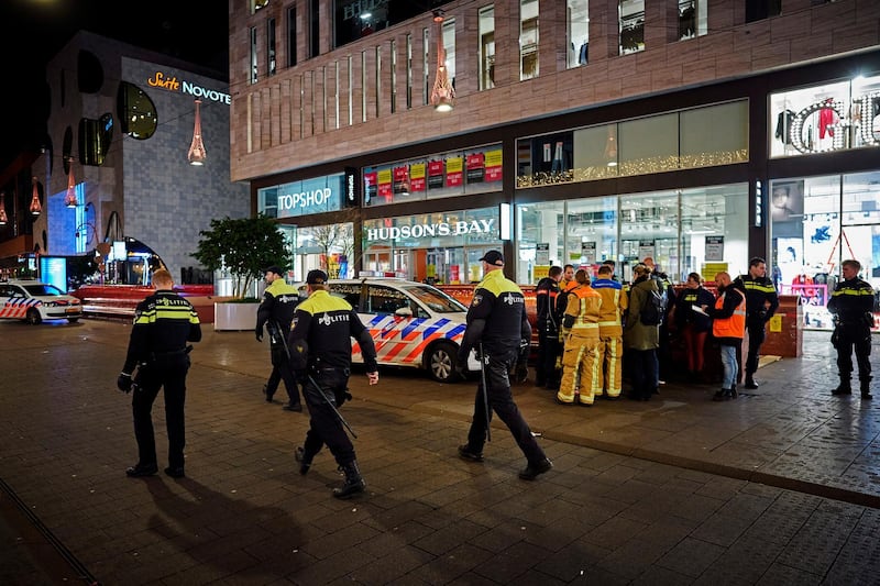 Dutch police secure a shopping street after a stabbing incident occurred in the center of The Hague, Netherlands, Friday, Nov. 29, 2019. Dutch police say multiple people have been injured in a stabbing incident in The Hague's main shopping street. (AP Photo/Phil Nijhuis)