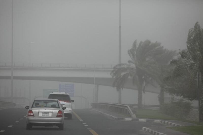 Motorists contend with strong winds and poor visibility while a sandstorm engulfs Dubai.  Antonie Robertson