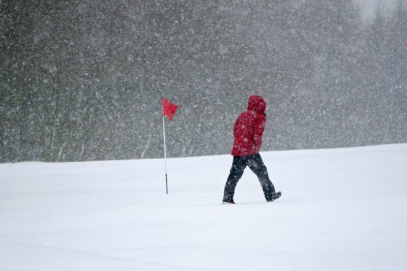 Snow falls on Saddleworth Moor golf course in Uppermill near Oldham. PA