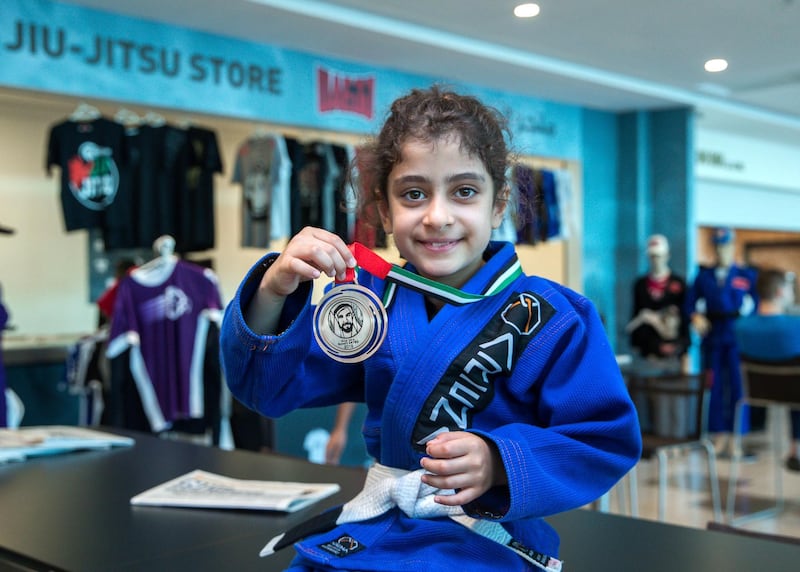 Abu Dhabi, UAE,  April 20, 2018.  Mariam Akeil shows off her silver medal for Kids-3.
Victor Besa / The National
Sports
Reporter: Amith Passela