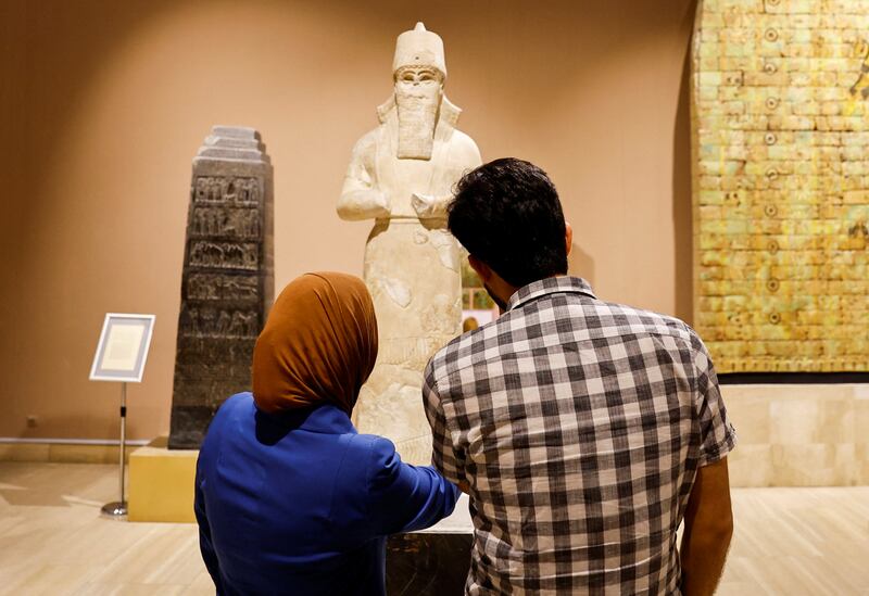 Visitors tour Iraq's National museum in Baghdad. It has reopened to the public after a three-year closure due to the spread of Covid-19 and local unrest. 