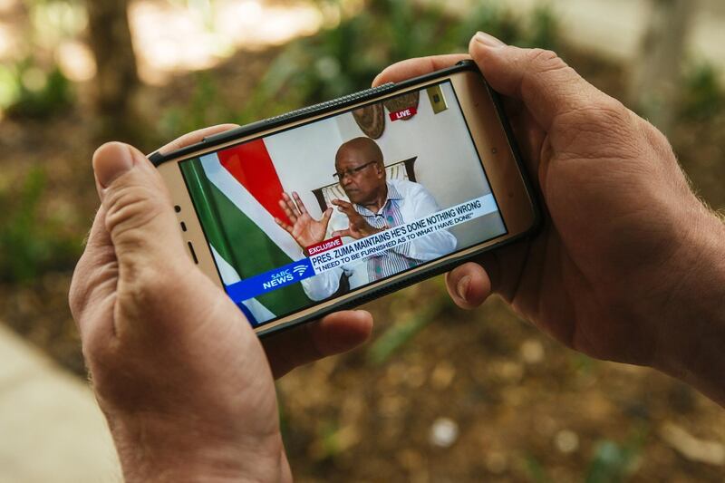 Jacob Zuma, South Africa's president, is displayed on a mobile device as he gives a televised interview in Pretoria, South Africa, on Wednesday, Feb. 14, 2018.  Zuma said the push by his ruling party for him to resign is “unfair,” in his first television interview since the African National Congress decided to replace him as the nation’s leader. Photographer: Waldo Swiegers/Bloomberg