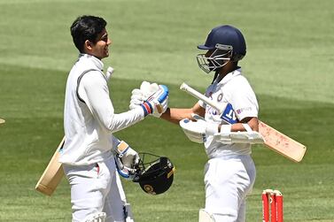 India batsmen Shubman Gill and Ajinkya Rahane celebrate after winning the second Test against Australia in Melbourne. Getty Images