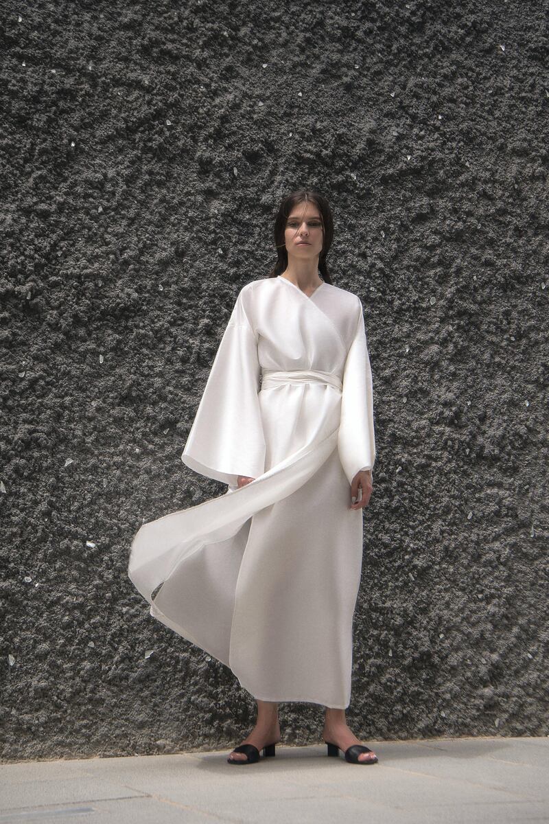 A sparse yet stylish white robe dress from SH Studio