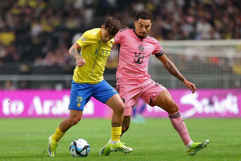 Al Nassr's Portuguese midfielder Otavio vies for the ball against Inter Miami's Brazilian midfielder Gregore. AFP
